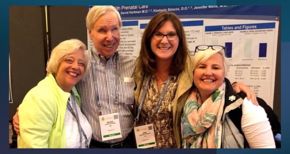 Dr. Simcox, Dr. Wells, and Dr. Hartman pose for a poster picture!